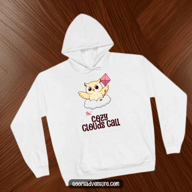 Funny Kawaii owl riding a kite shaped like a friendly cloud on a warm hoodie, perfect for aspiring flyers.