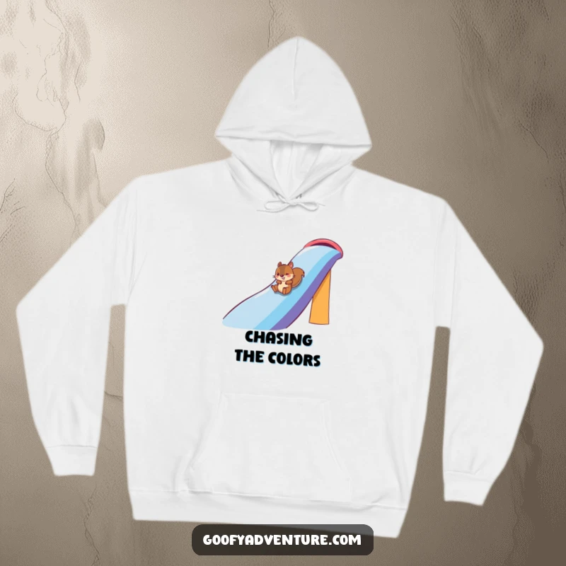 Funny squirrel character on a massive rainbow slide, featured on a comfortable hoodie, bringing warmth and cheer, funny gift.