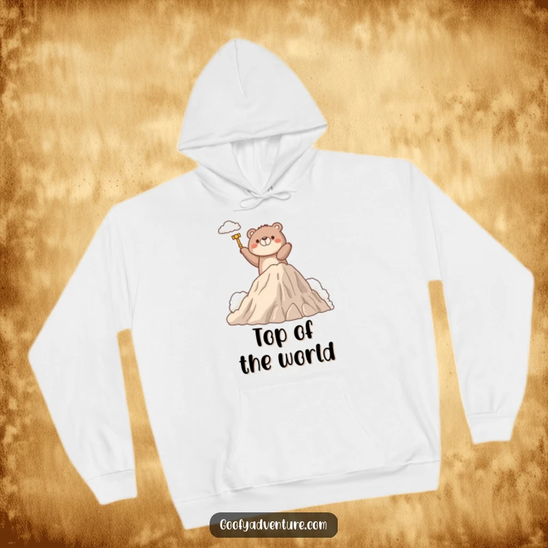Funny hoodie with a determined bear character triumphantly climbing a fluffy cloud mountain, offering warmth and a symbol of success.