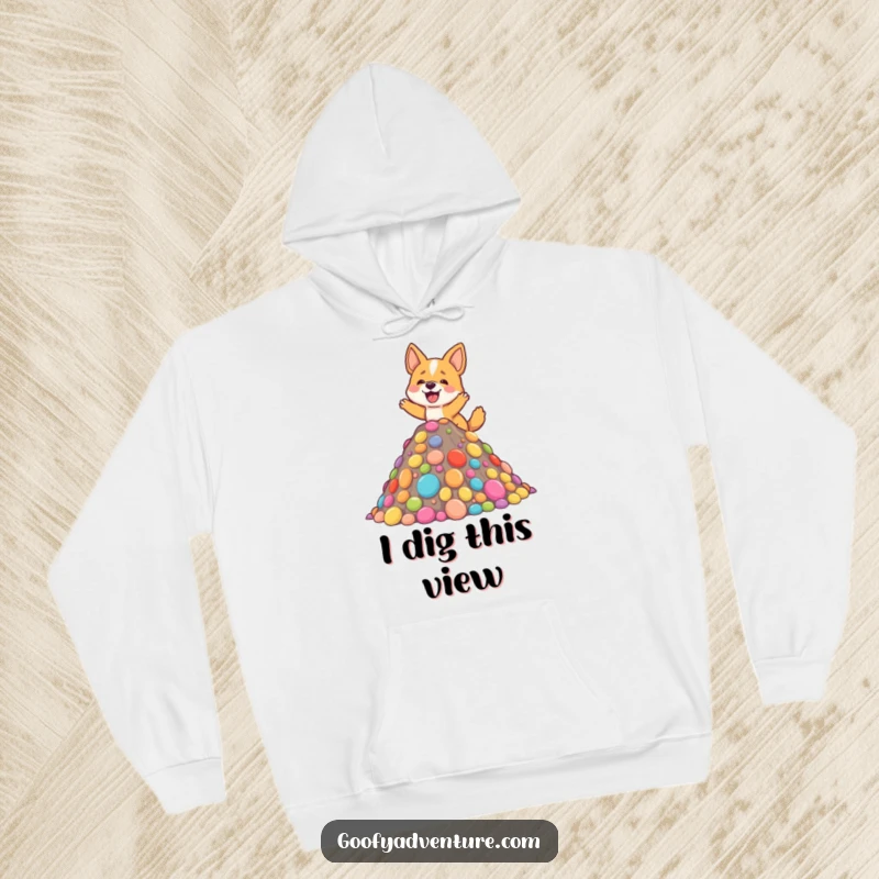 Funny hoodie featuring a delighted dog energetically climbing a colorful, giant mountain composed entirely of delicious-looking candy.