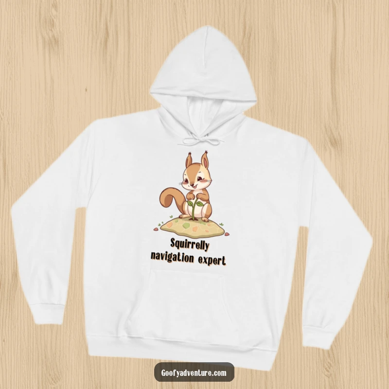 Funny hoodie depicting a focused squirrel planting a seed that evolves into a navigational map, perfect for adventurers.
