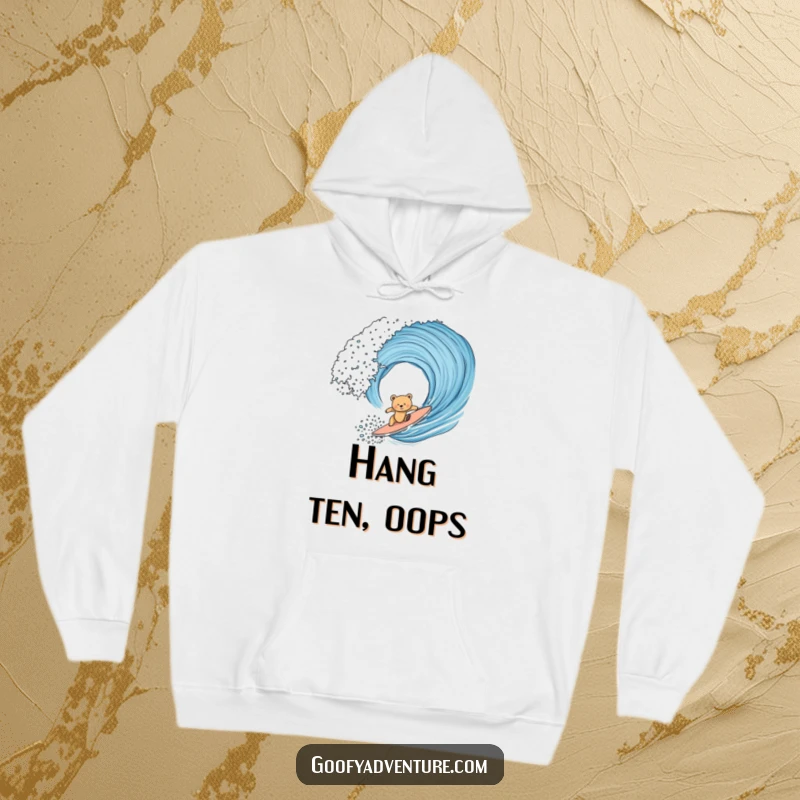 Funny bear cub in mid-surf on a giant wave, depicted on a cozy hoodie, conveying a humorous struggle with the ocean's power.