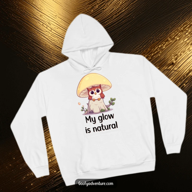 Funny hoodie depicting a curious owl peeking out from behind a large, vividly glowing mushroom deep within an enchanted forest.