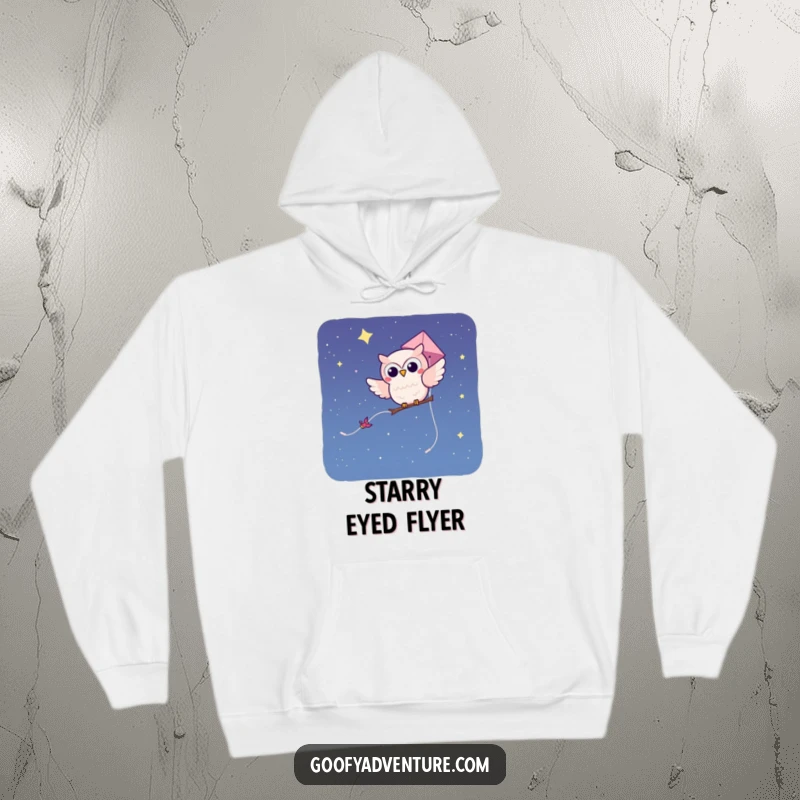 Funny kawaii owl character on a kite soaring through a starry night sky, featured on a warm, comfortable hoodie.