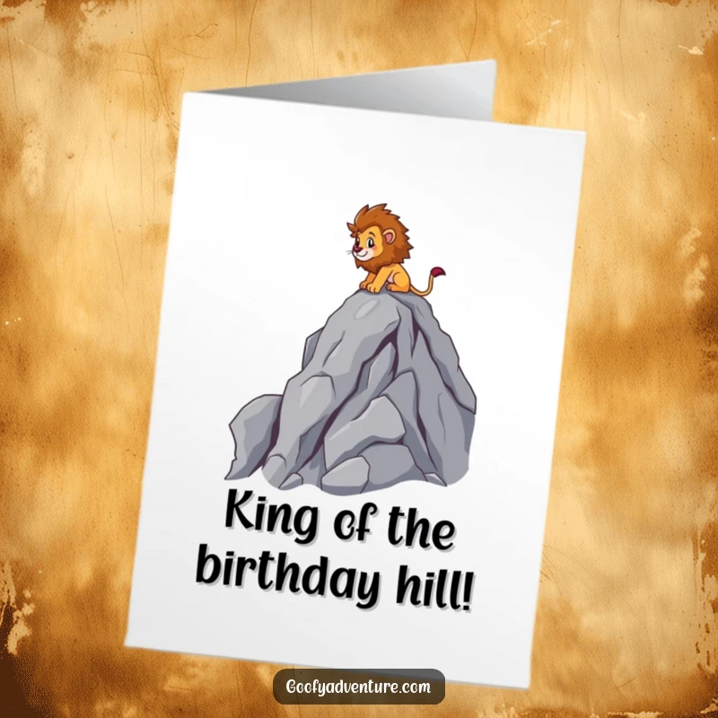 Funny Free Printable Birthday Card: Brave lion character triumphantly scaling a cartoon mountain peak, celebrating with gusto.