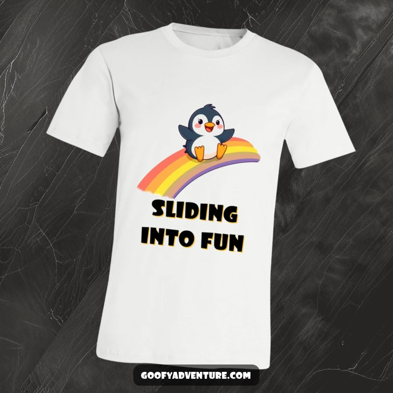 Funny Penguin t-shirt, joyfully sliding down a giant rainbow, spreading happiness and cheerfulness.