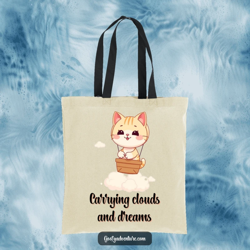 Funny tote bag showcasing a charming cat navigating a hot air balloon over a landscape of fluffy, ethereal clouds.