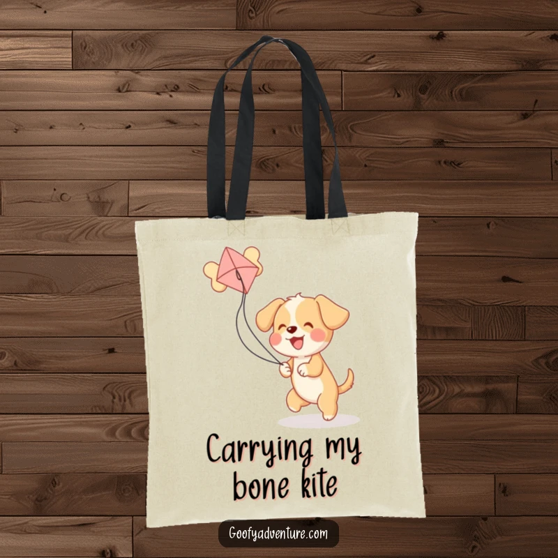 Funny puppy excitedly playing with a bone-shaped kite, printed on a durable tote bag for a humorous carry-all.